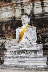 Old stone statue of a Buddha in Ayutthaya, Thailand.