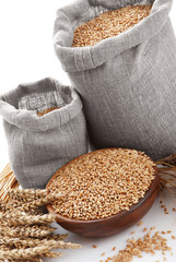 Grain of the wheat in bags and a bowl