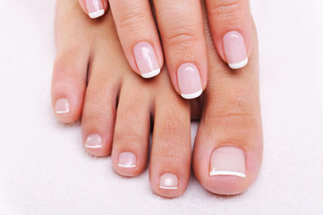 Beauty nails of a female hand and feet