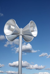 Chromed loudspeakers with sky background