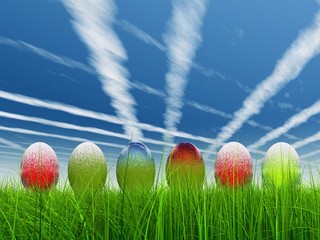 High resolution Easter eggs in grass over sky with plane trails