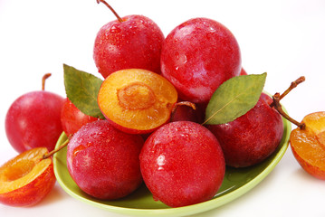 plums isolated on white