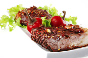 served roast steak on plate