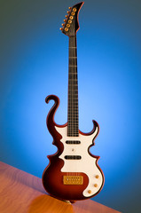 Fototapeta na wymiar Wood guitar against gradient background