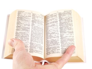 Person holding a book wide open against white background