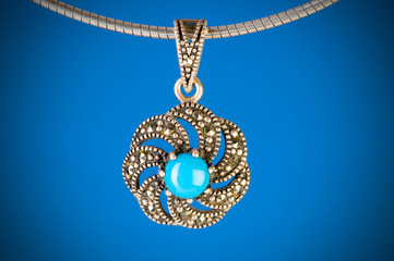 Pendant against colour gradient background