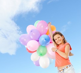 Fototapeta na wymiar Happy girl with balloons