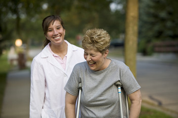 Physical therapist laughs with a patient