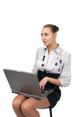 Young business woman working on the notebook