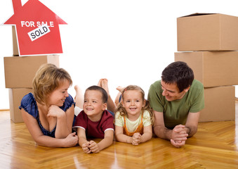 Fototapeta premium Happy family with two kids in their new home