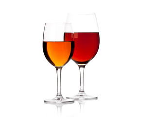 Two glasses of red wine against white background