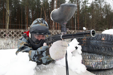 Paintball player with a gun