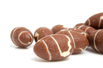 chocolate easter eggs over white background