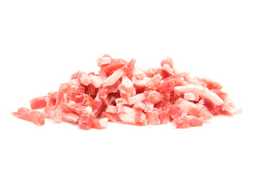 pile of raw diced bacon over white background