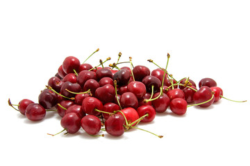 Pile of cherries over white background