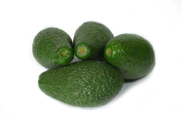 Four ripe fresh avocado isolated on white