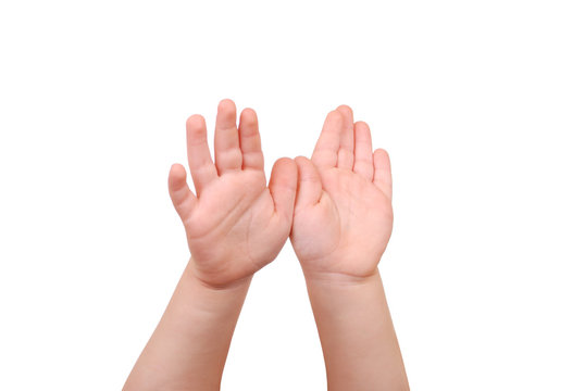 Children's hands palms upwards on white