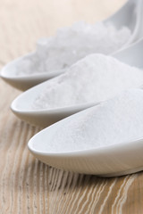 three spoons with difrent salt