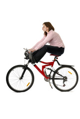 Fototapeta na wymiar jeune femme sur un vélo les jambes en l'air