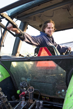 Farm hand in a tractor