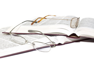 reading glasses on the books