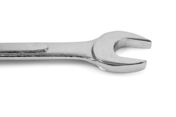 Metallic spanner in a white background