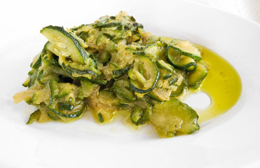 Courgettes sliced thinly and cooked with olive oil and onions.
