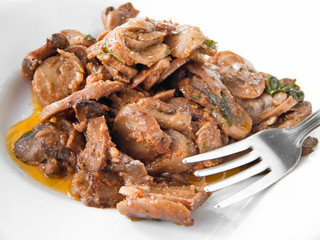 Mushrooms cooked with olive oil, tomato sauce and parsley.