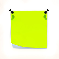 Yellow sheet of paper attached to the white wall