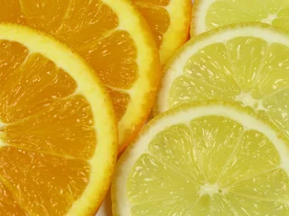 Fotobehang Schijfjes citroen en sinaasappel © Bernd S.