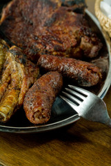 Sausages and steak on a tray