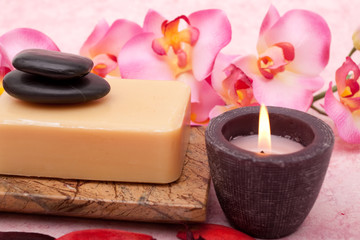 Fototapeta na wymiar Aromatherapy candle, soap and orchid