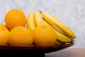 Oranges and bananas in a fruit bowl - 20760309