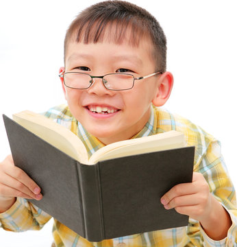 asian boy with glasses holding a book