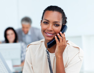 Charming businesswoman talking on phone