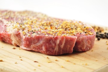 raw steak and spice