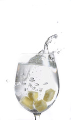 Fruit falling in a glass