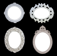 Four White Antique Frames on Black Background