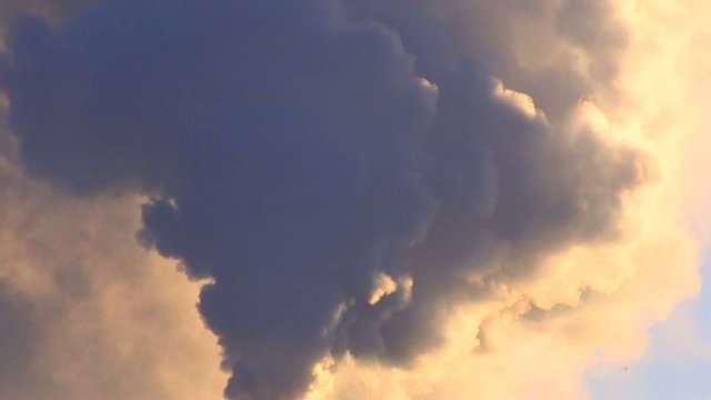 HD Exhaust smoke on blue sky background