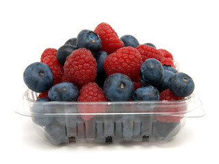 Basket with a raspberry and a blueberry