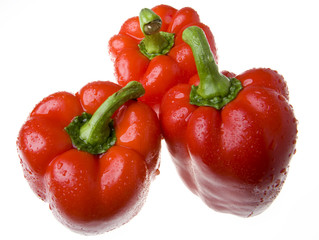 red juicy peppers on white background