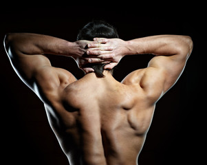 Obraz na płótnie Canvas Back of muscular young man