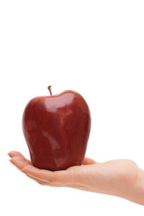 Red apple in woman hand isolated