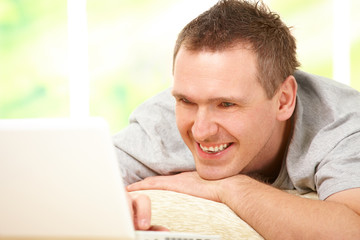 Man relaxing with laptop