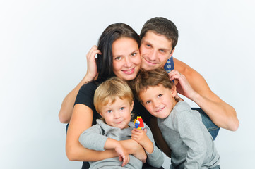 portrait of happy young family with two sons