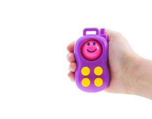 toy phone in hand isolated on white background