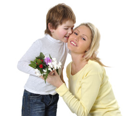 Son giving flowers to his mom