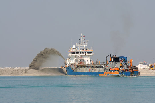Special dredge ship pushing sand to create new land