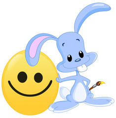Cute bunny with his painted smiley Easter egg