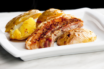 roasted pork meat with potatoes